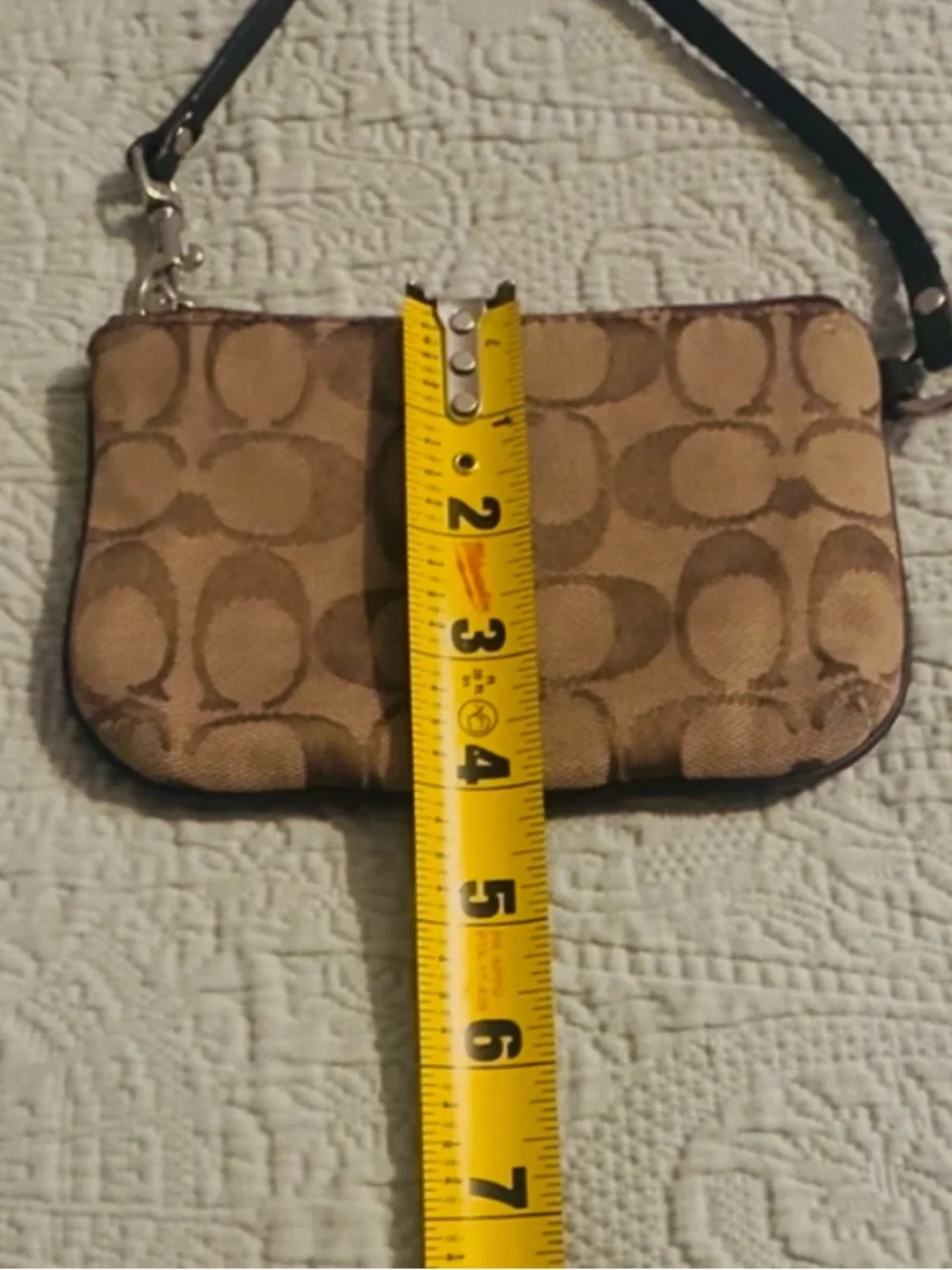Coach Signature tan/brown canvas wristlet, w/strap, good/used.